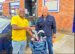 Raman Thukral presenting the golf equipment to Pius Ayeh Appiah