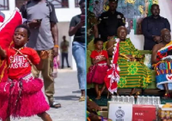 When the boy needed a restroom break, he asked Otumfuo to hold the flag
