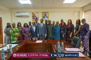 Members of the UniMAC Governing Council in a group photograph with Education Minister