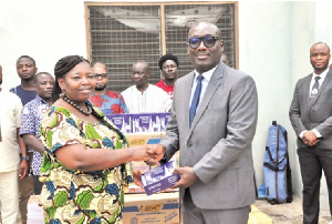 The donation included 10,000 exercise books, 4,000 pens, and 3,456 pencils