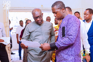 Oppong Nkrumah (left) tasked contractor to complete project