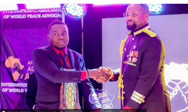 Alhaji Yussif (left) receiving his award from Dr Samuel Ben Owusu