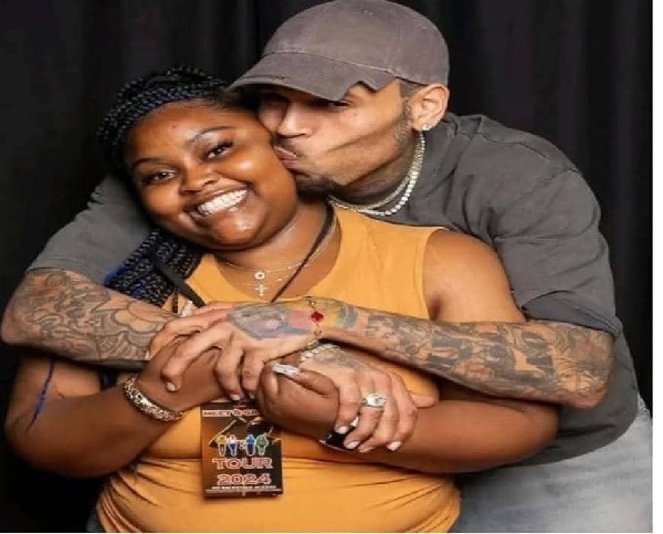 The photo showed Brown hugging her from behind and kissing her cheek.