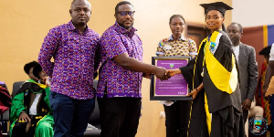 Sandra Kumah receiving her award