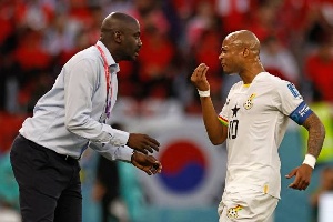 Otto Addo (left)  talking to former Black Stars captain, Andre Dede Ayew