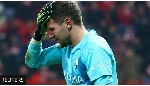Bochum goalkeeper Patrick Drewes grabs his head after being hit by an object thrown from the crowd