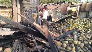 The blaze, which started around 1 a.m., consumed metal containers and wooden structures