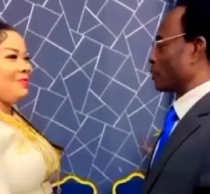 In the video, she kneels for his prayer and later engages with her junior pastors.