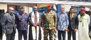 A group picture of DC Ackwerh (rtd), 3rd left, and some guests at the RECOA Remembrance Service