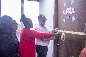 Vivo Energy Ghana's HRM, Mercy Amoah and Managing Director, Jean-Michel Arlandis cutting the tape to