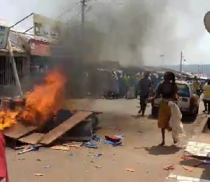 Police intervened to restore order while fire officers extinguished flames