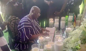 Dr. Mahamudu Bawumia signing the book of condolence