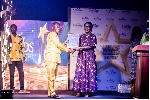 Kofi Senya, the national overall best agent for 2024, receiving a citation from Mrs. Boampong