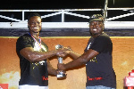Asoka receiving his cash prize from the Brand
