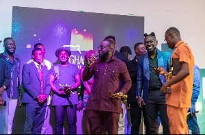 Lekzy Decomic delivering a speech on the awards night