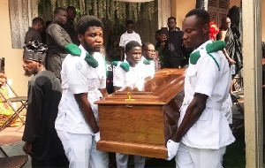 Pallbearers carried the remains of Teddy Osei