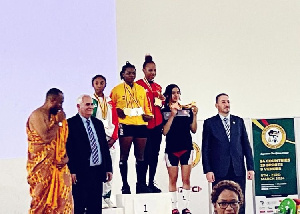 Ntumi claims the top spot on the podium following her exceptional performance in weightlifting