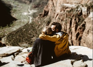 couple sitting on  a mountain