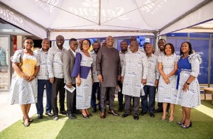 Mr. Kutortse (middle) in a group photograph with board members and staff of serene insurance
