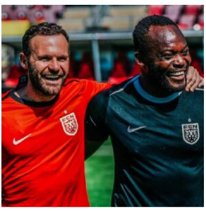 Juan Mata (L) and Michael Essien