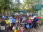 Danny List flanked by kids at Achimota Golf Club