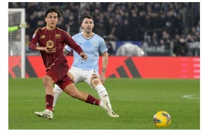 Dybala of AS Roma compete for the ball with Alessio Romagnoli