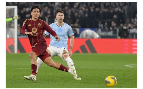 Dybala of AS Roma compete for the ball with Alessio Romagnoli