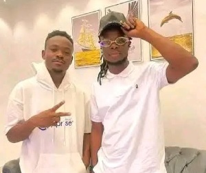 Maccasio on the left with Lazzybwoy in cap