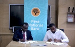 Kojo Addo-Kufuor, Executive Head of Home Loans Business at First National Bank signing the agreement
