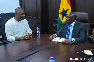 Idris Elba having a conversation with Bawumia