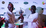 A member of the Ahimota Golf Club receiving the trophy