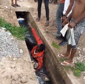 As punishment, he was dragged to a clogged gutter filled with refuse