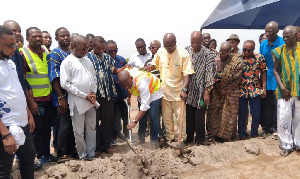 Kojo Oppong Nkrumah cuts sod for the housing project